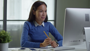 young-asian-businesswoman-sitting-in-front-of-computer-in-the-office-and-having-video-call_bd8f9bpzx_thumbnail-full01